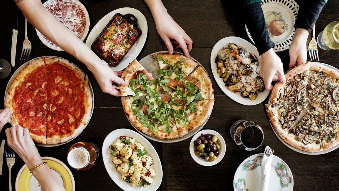Picture: A spread at Pizzeria Lola featuring the Marinara, Iowan and Forager pizzas, Brussels sprouts, roasted cauliflower and more. 